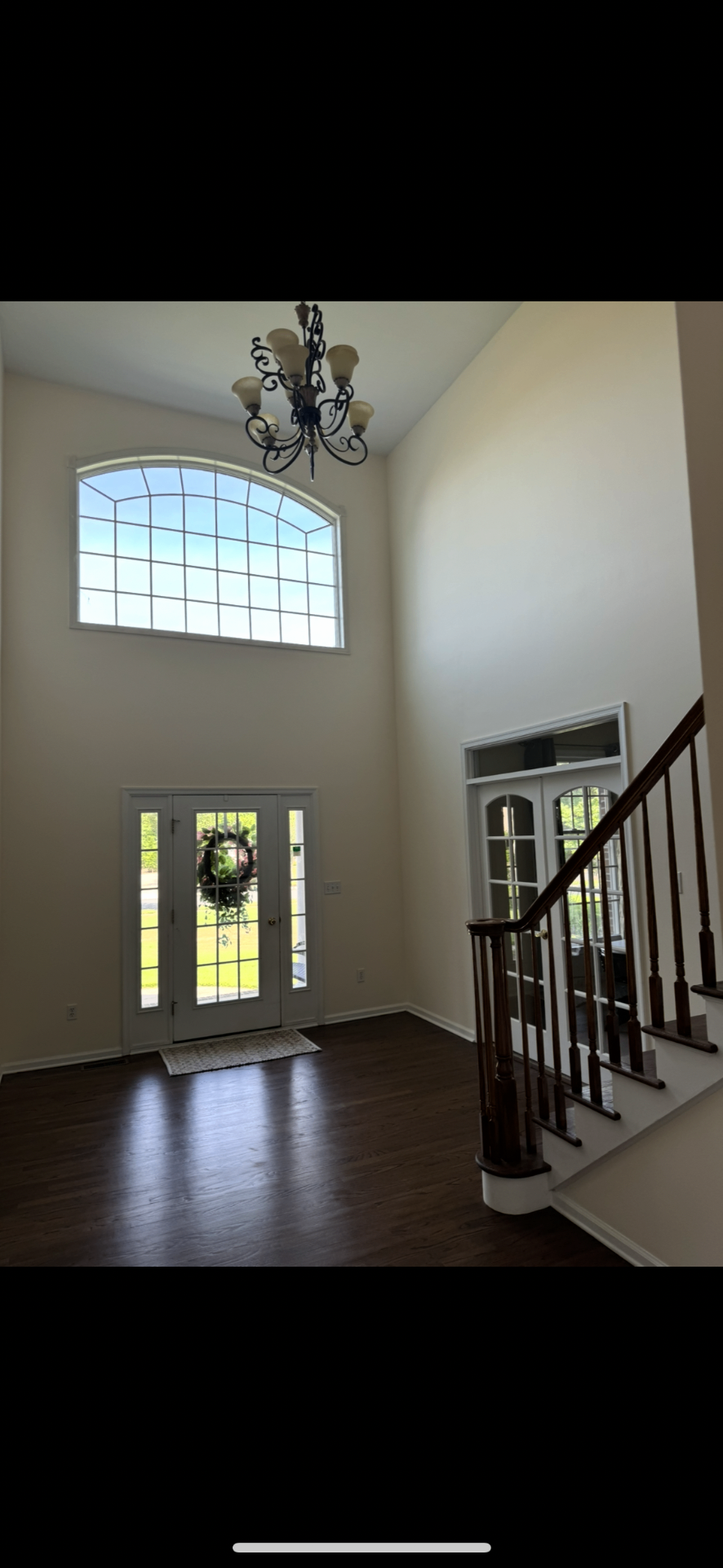 Two-story residential foyer — interior paint & finish